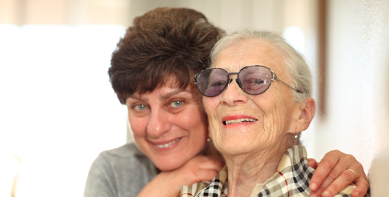 two senior woman smiling